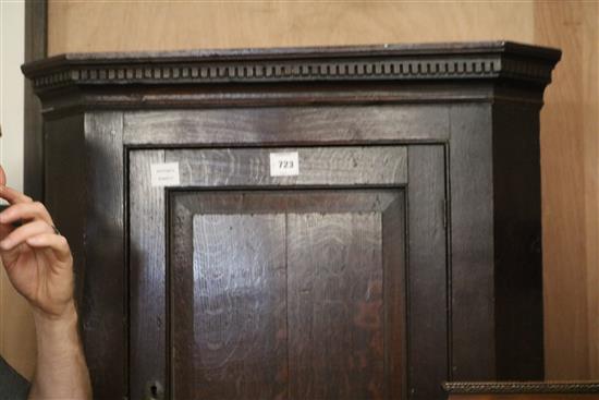 A George III oak hanging corner cupboard, W.81cm